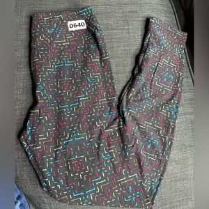 LuLaRoe Black Leggings with Red, yellow & Teal design.  One size. $5 bundle deal